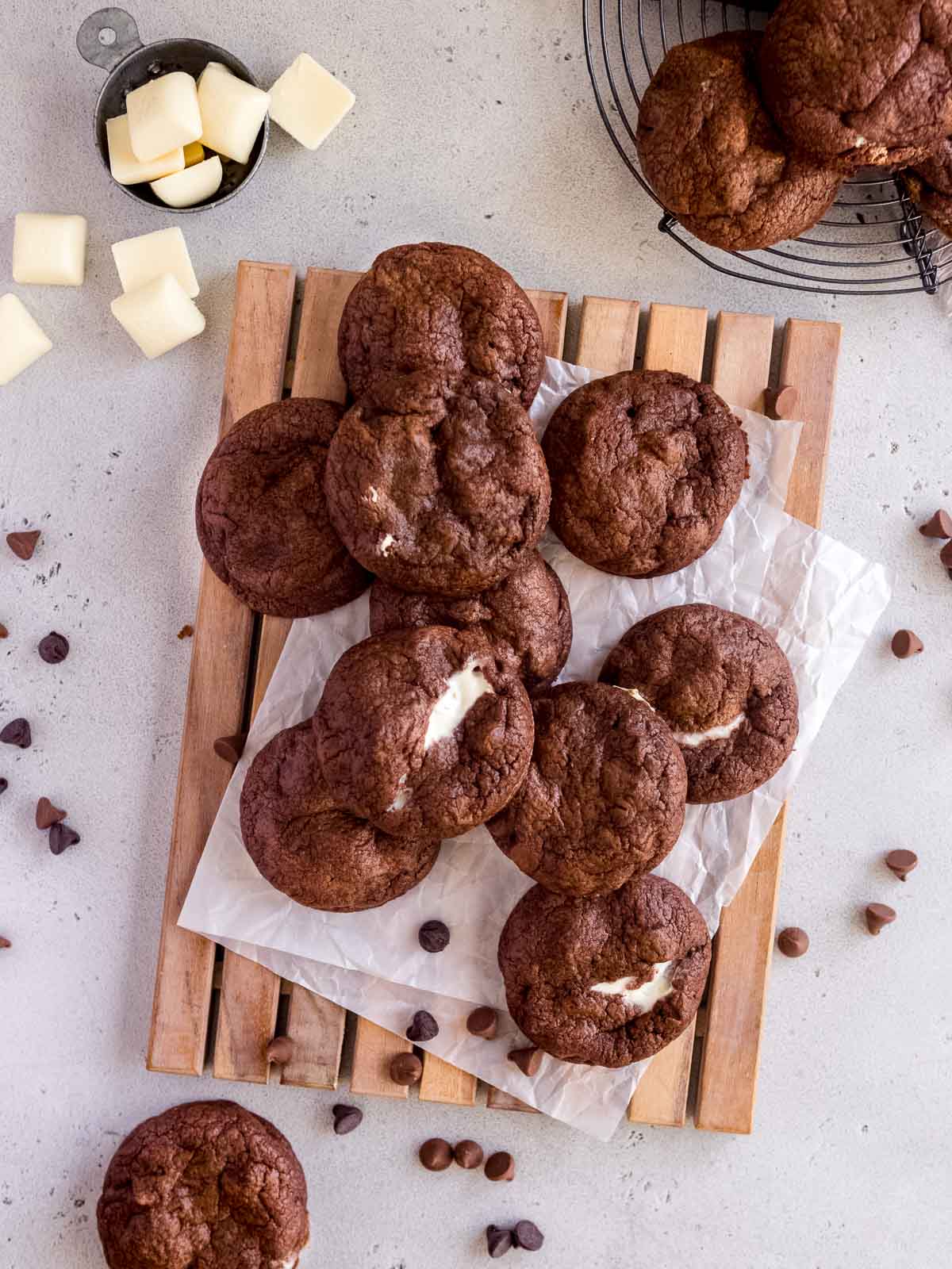 triple chocolate cookies on a wooden tray