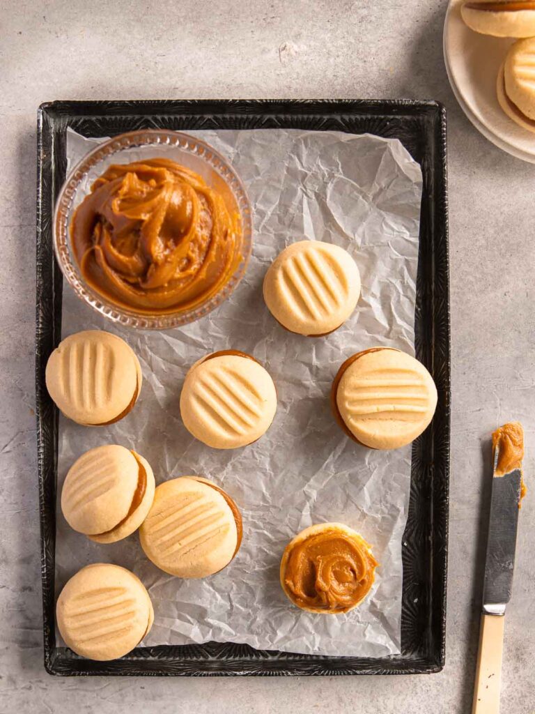 Salted caramel melting moments on a tray.
