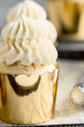 Soft and fluffy vanilla cupcakes, decorated with vanilla bean frosting.