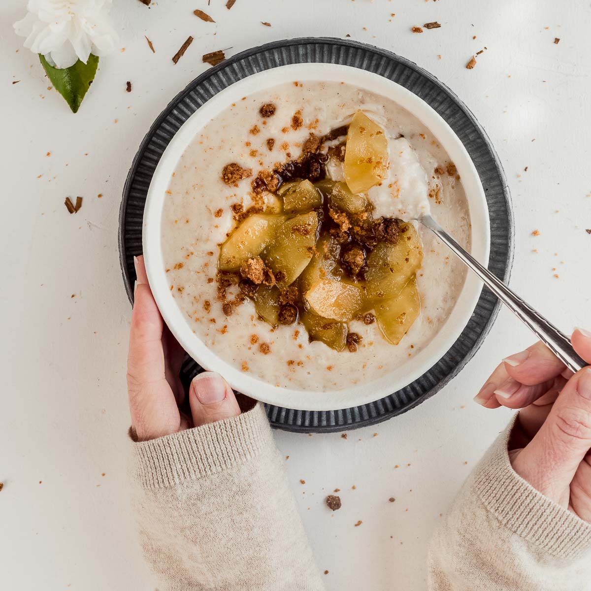 A bowl filled with warm apple pie porridge.