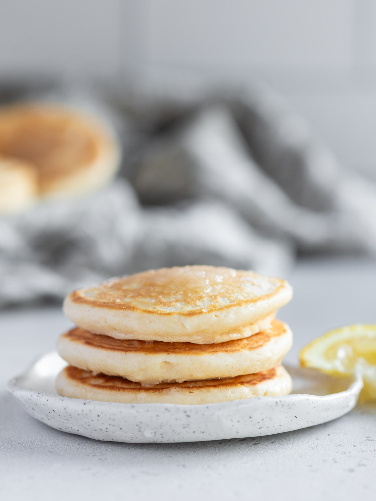 Soft, fluffy mini pancakes or pikelets are delicious served with lemon and sugar.