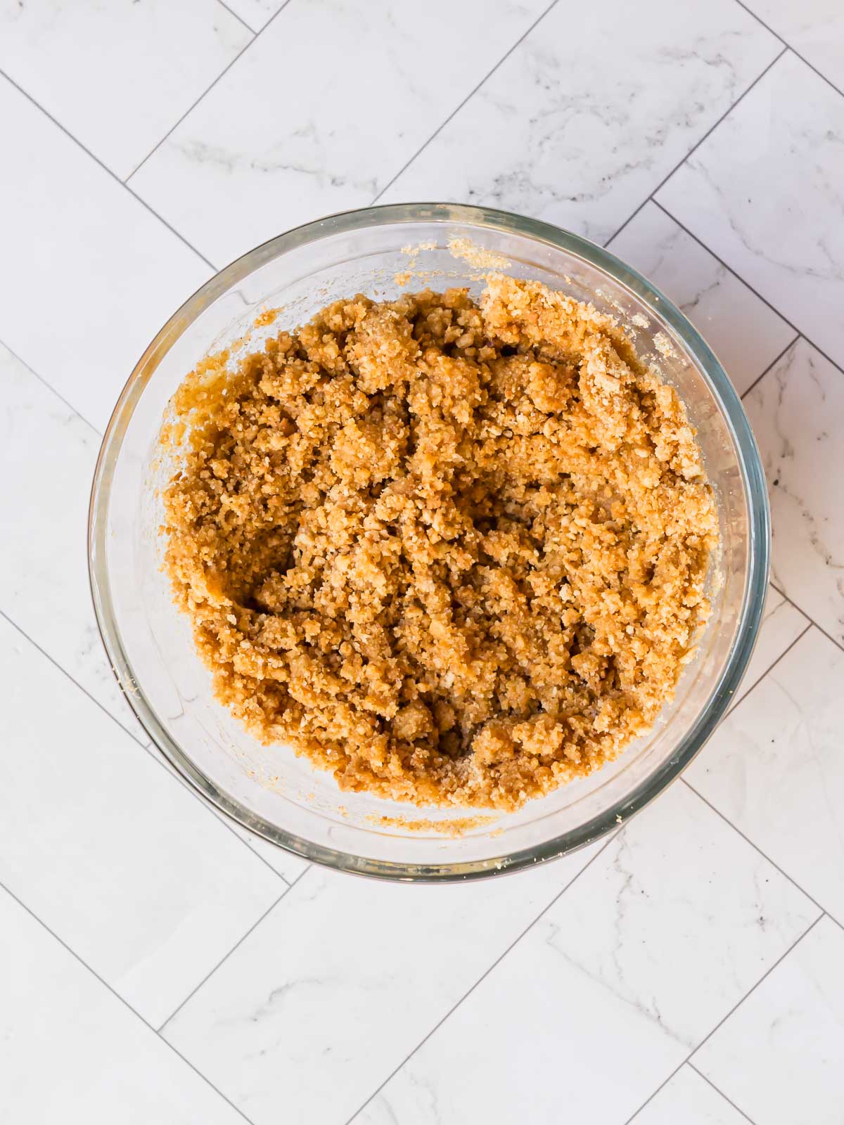 Crushing gluten-free digestive biscuits for the crust of the gluten-free Key Lime Pie.