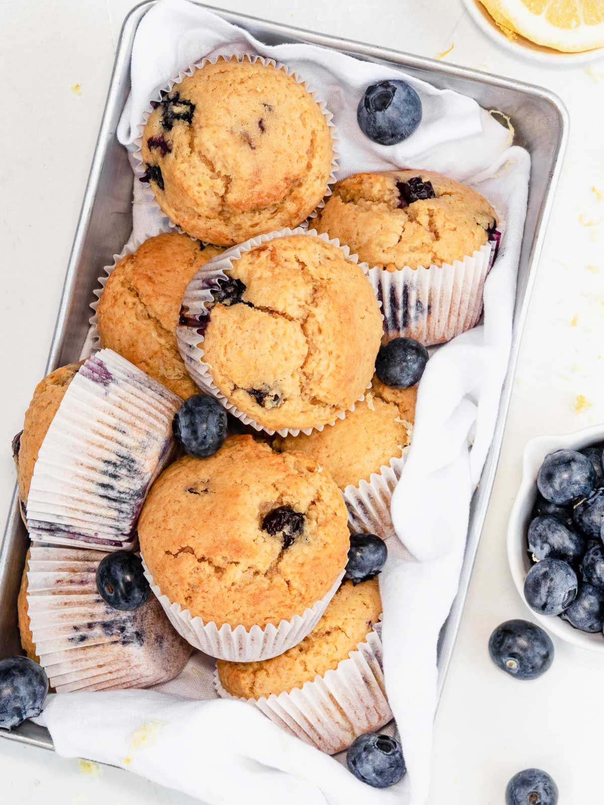 Lemon blueberry muffins in a pan.
