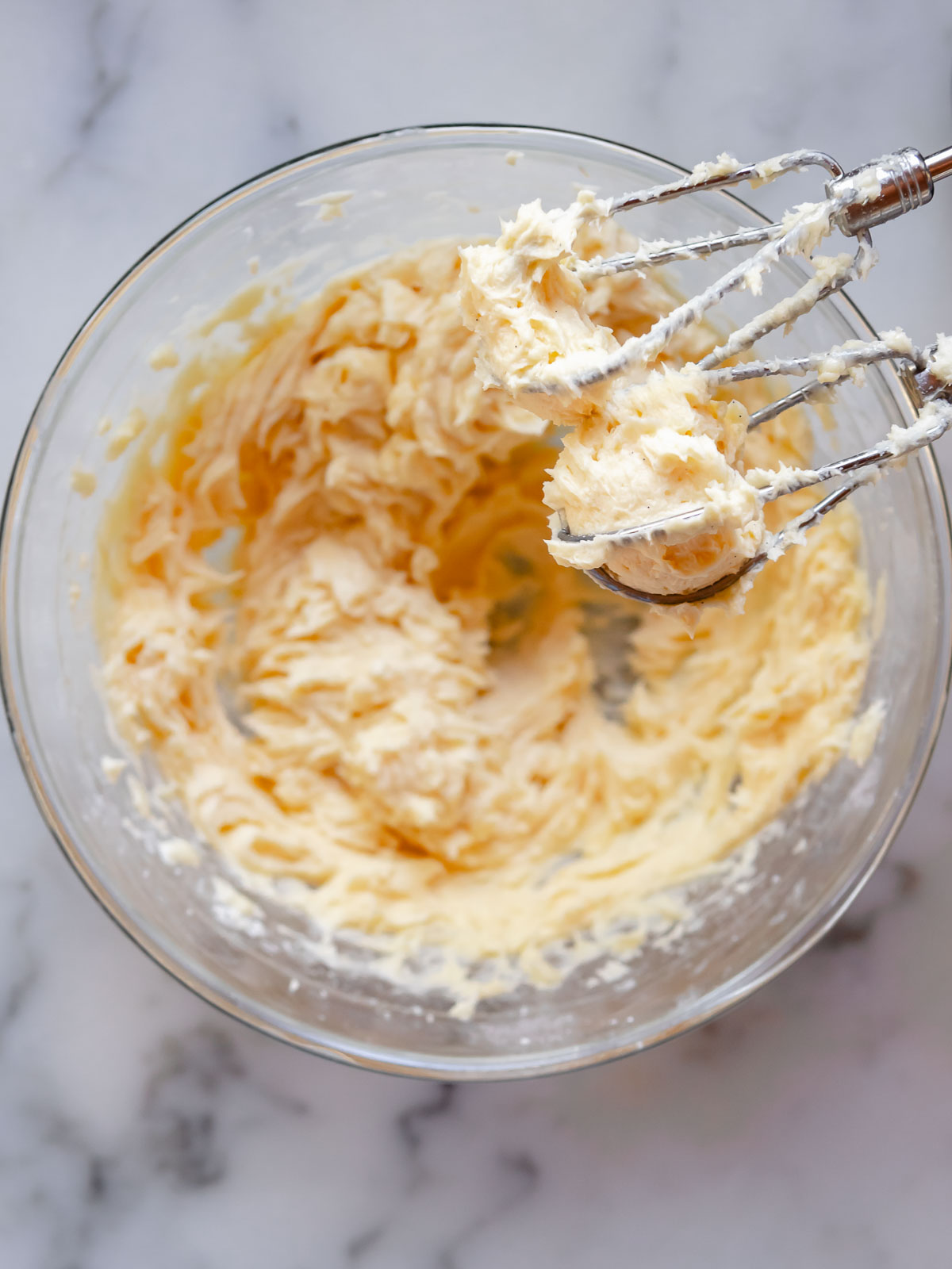 Room temperature egg and vanilla paste added to creamed butter mixture for rich, bakery-style flavour.