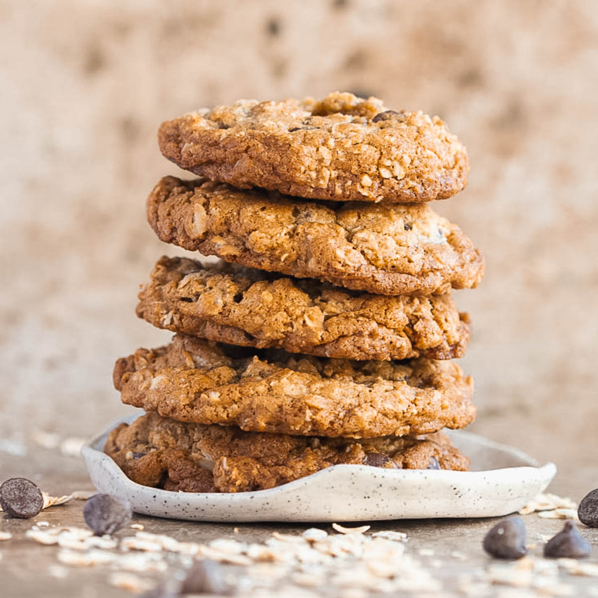 5 browned butter oatmeal cookies stacked on a plate
