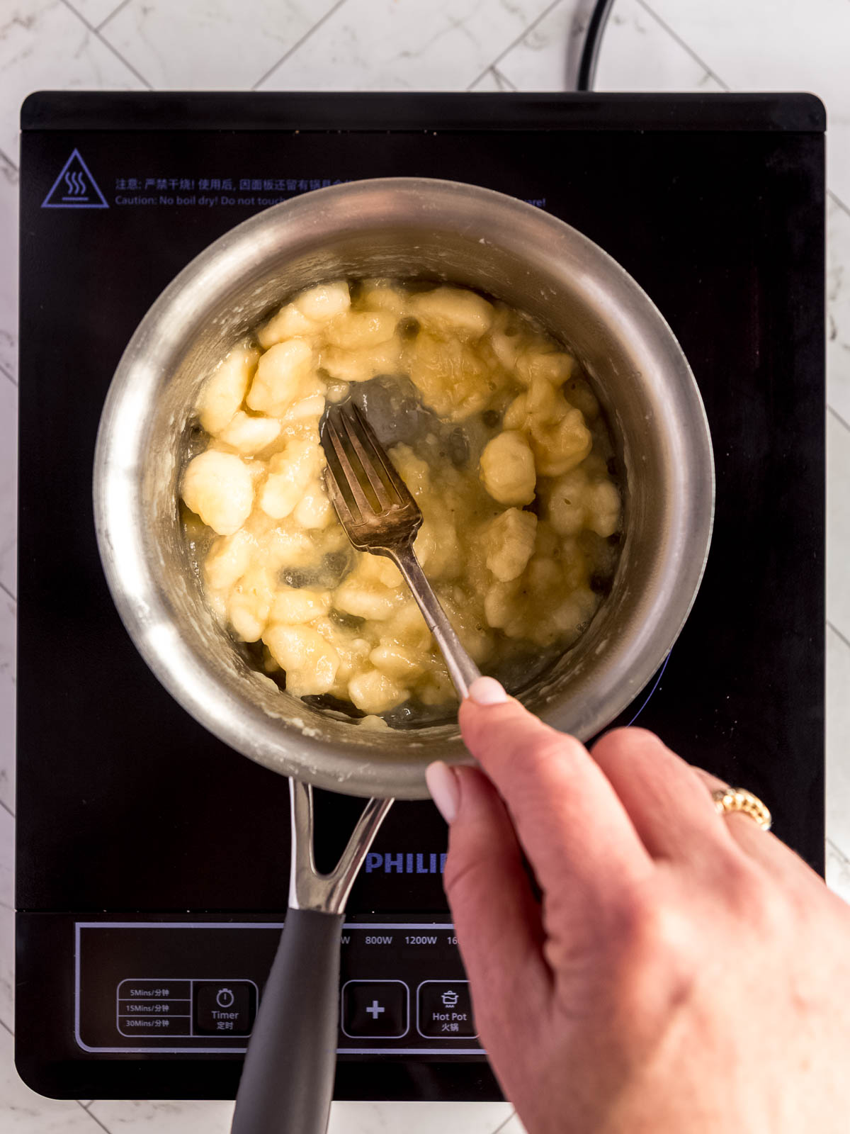 Heating the bananas, for a richer banana flavour in this cheesecake.