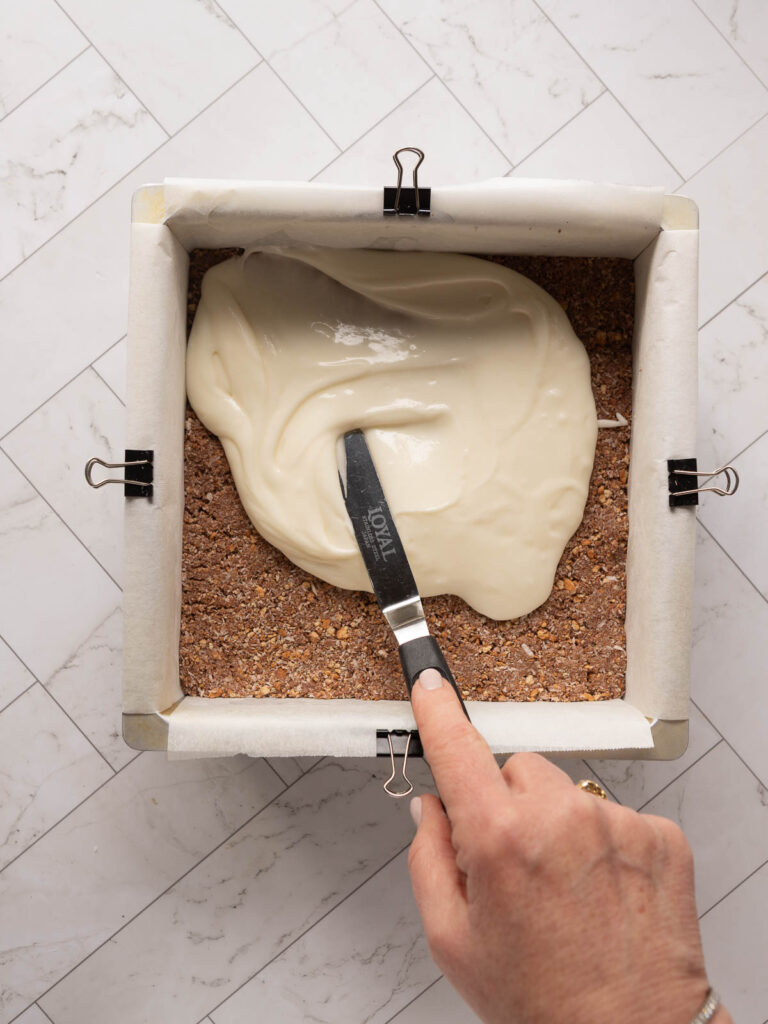 Spreading the peppermint layer onto the base.