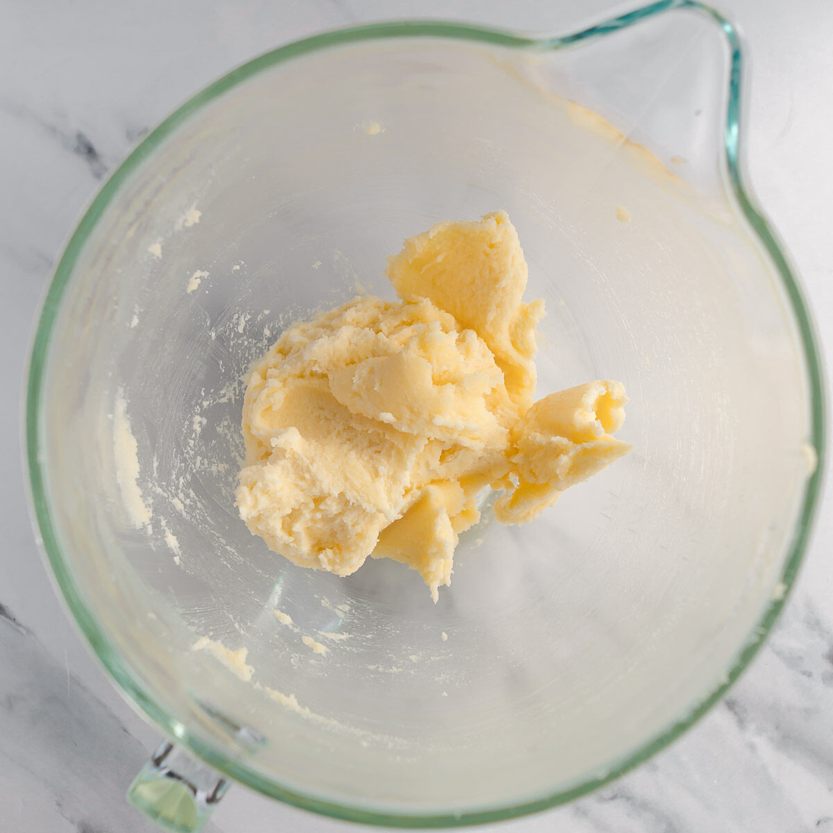 Creaming the butter and sugar to make a 3 layer vanilla cake