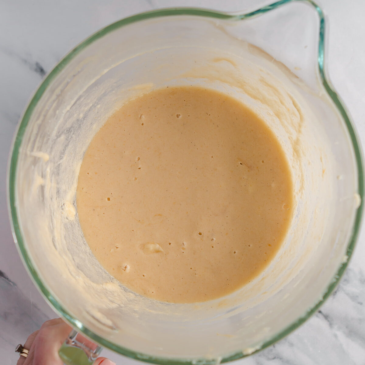 Adding the eggs and vanilla to make a 3 layer vanilla cake.