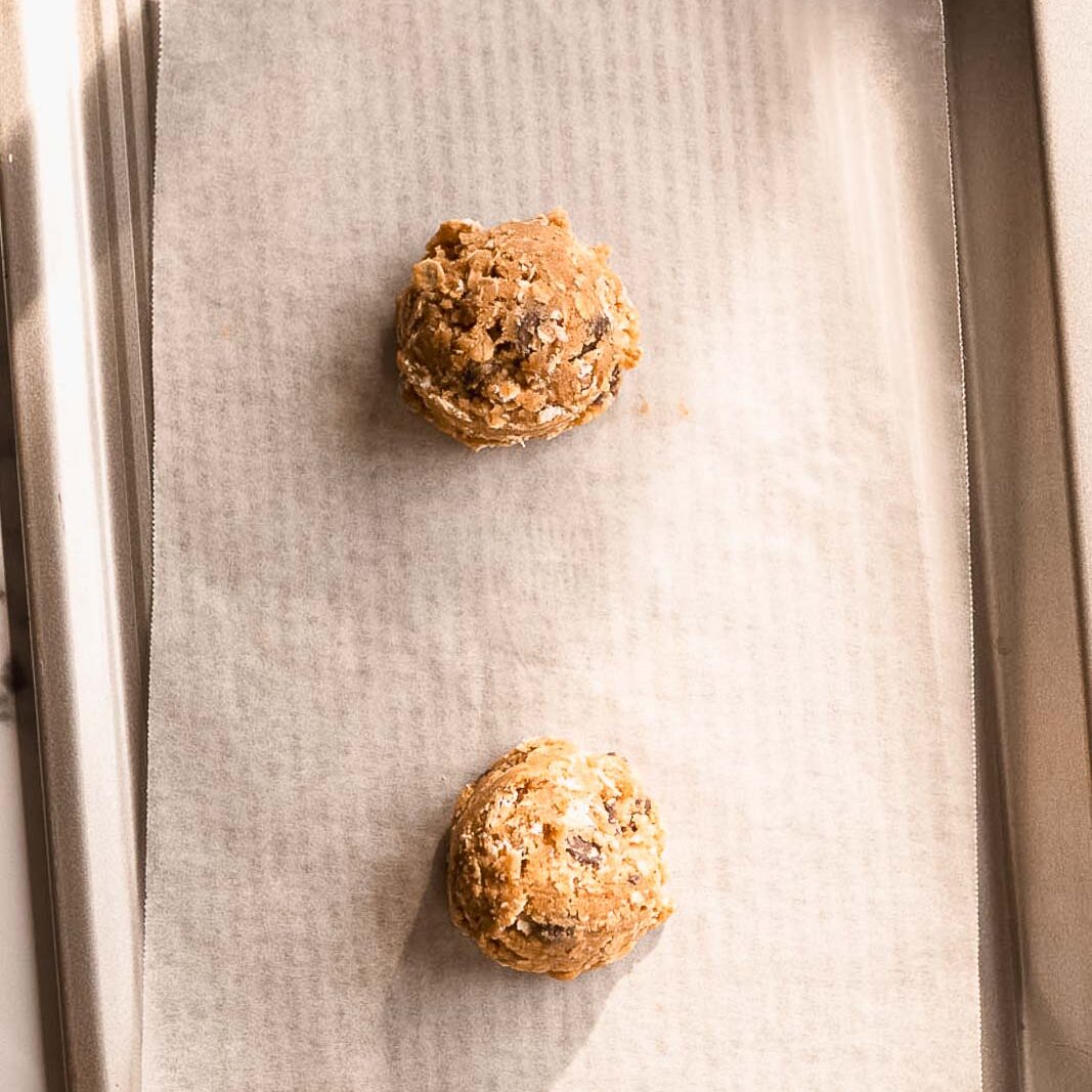 Frozen cookie dough on a small baking sheet