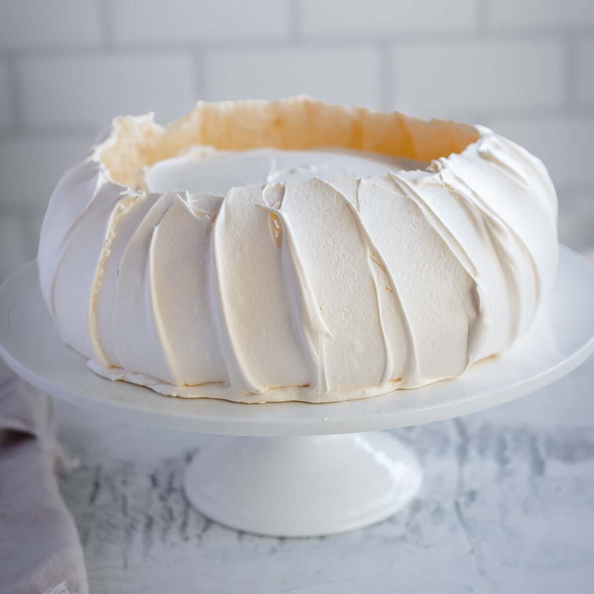 Baked pavlova with crisp white shell.