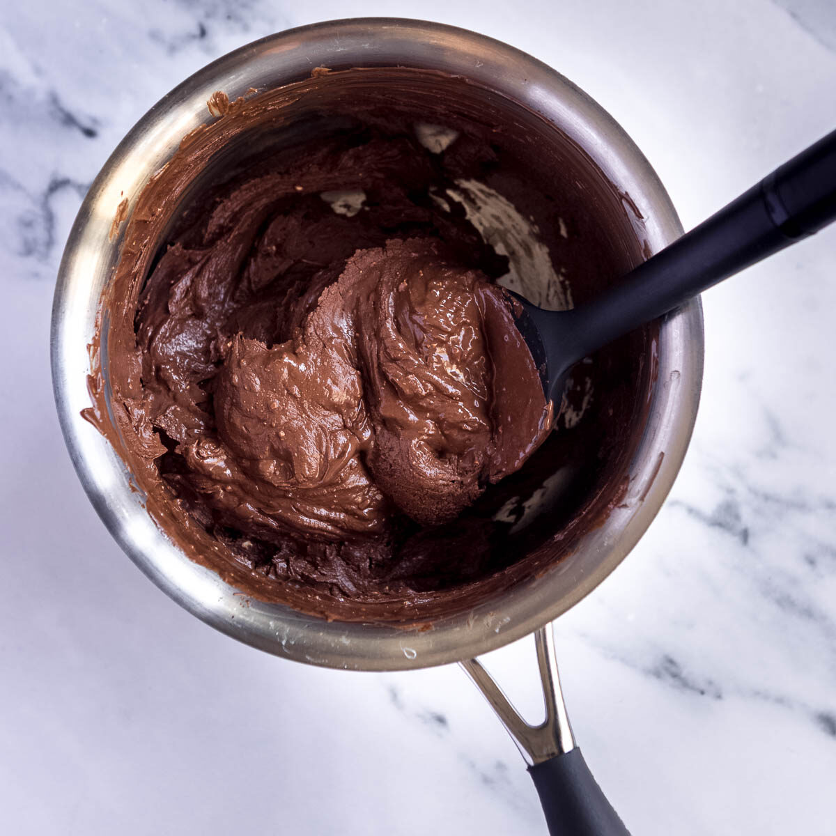 How to make an easy toblerone mousse -start by melting the chocolate and butter.