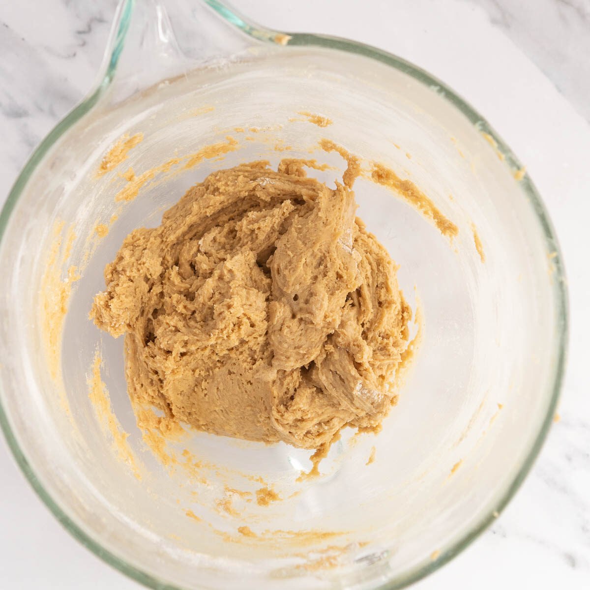 Adding flour to make no chill chocolate chip cookies.