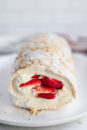 An easy pavlova roll recipe, filled with strawberries and chantilly cream.