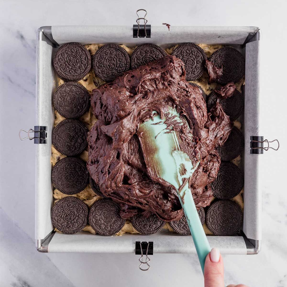 Top the oreo layer with my ultimate brownie mixture to make triple layer brownies.
