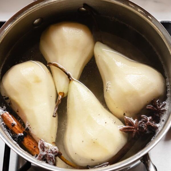 Poached pears without wine, using a sugar syrup and spices.