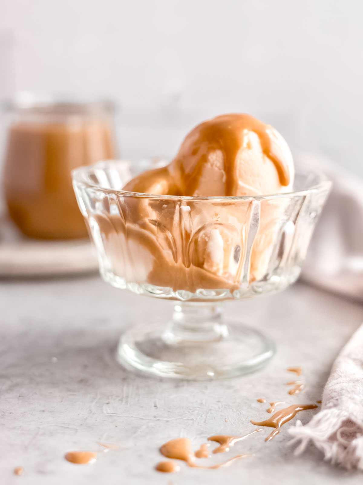 Rich butterscotch sauce drizzled over vanilla ice cream.