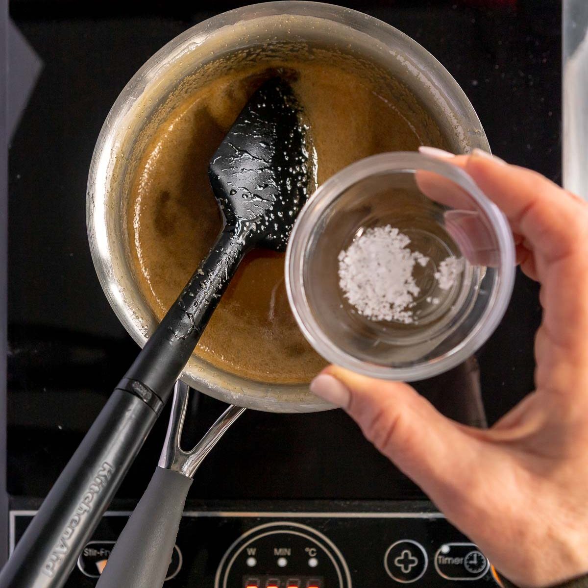 Adding vanilla and salt flakes to make the butterscotch sauce.