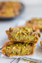 Dubai chocolate chip cookie cut in half to show the rich kataifi and pistachio filling.