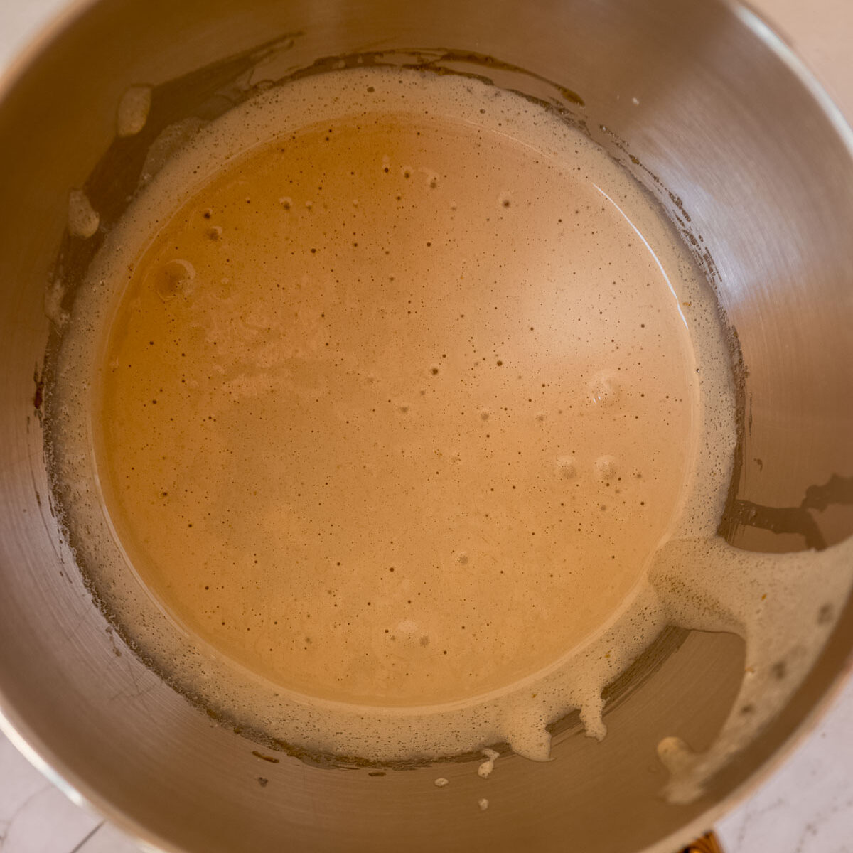 Whisked eggs and sugar to make fudgy espresso brownies.