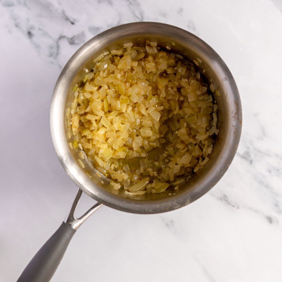 Sauteed onions and garlic in a saucepan.