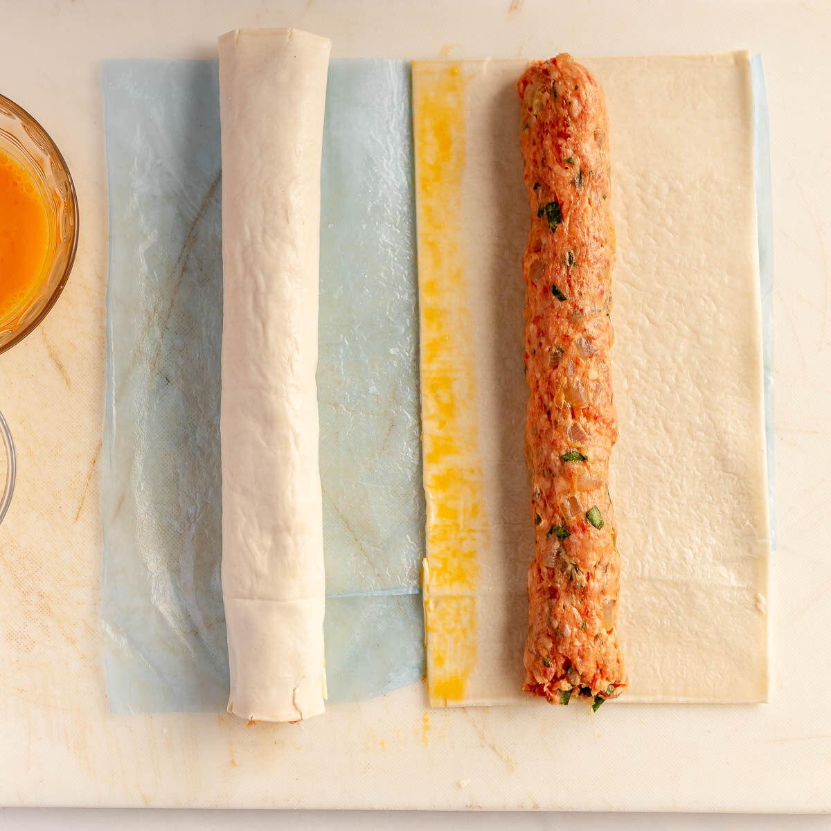 Use the plastic sheet from the pastry as a guide to lift and roll.