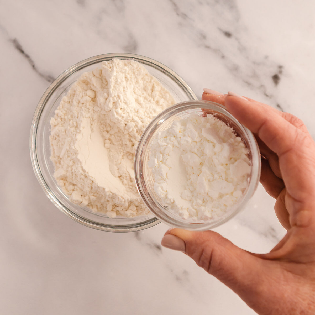 Adding cornflour to plain flour, to make cake flour.