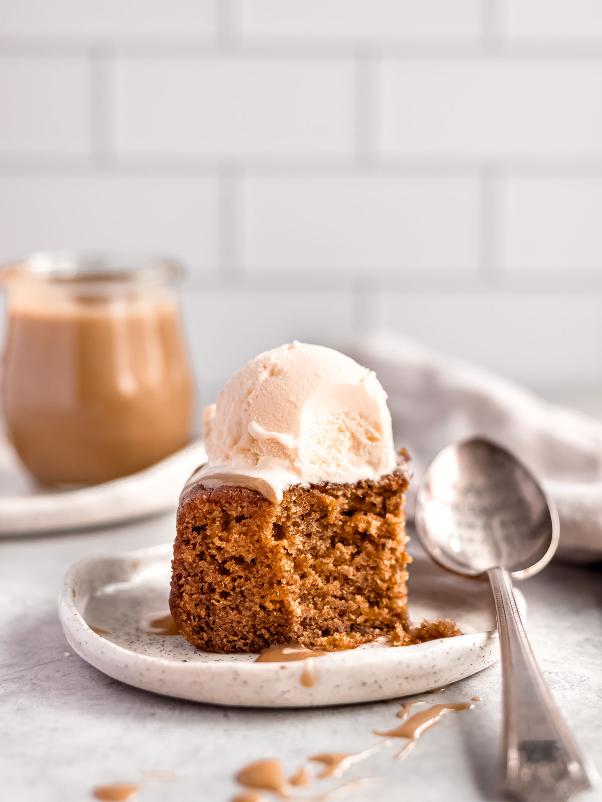 A single serve of sticky date pudding.