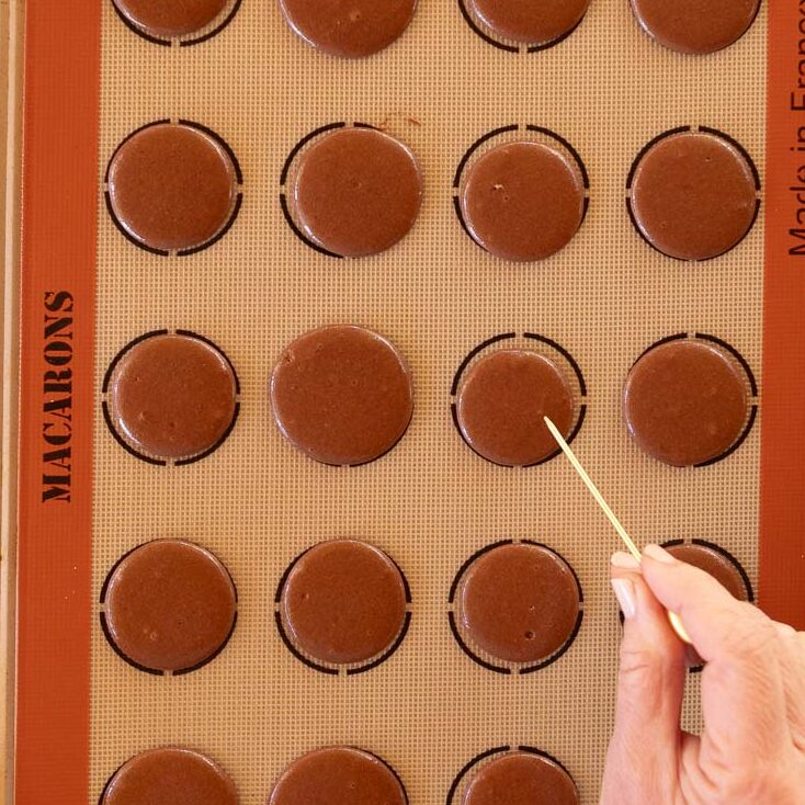 Using a toothpick to remove any air bubbles.