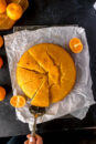 A round mandarin cake, soaked in citrus syrup.