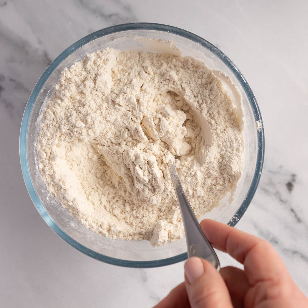 Combining the dry ingredients in a bowl.