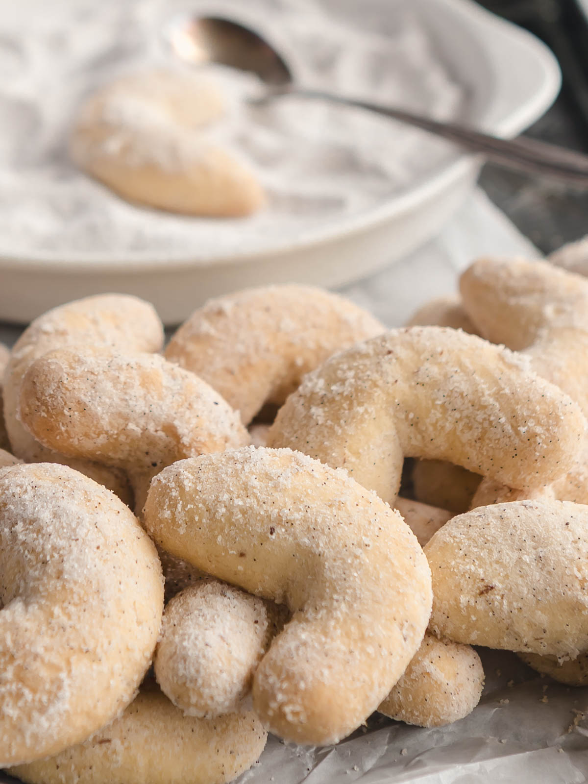 A tray of Austrian vanilla crescent cookies, dusted in vanilla sugar.