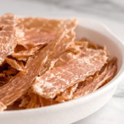 Dehydrated chicken breast strips are healthy, additive-free treats safe for dogs.