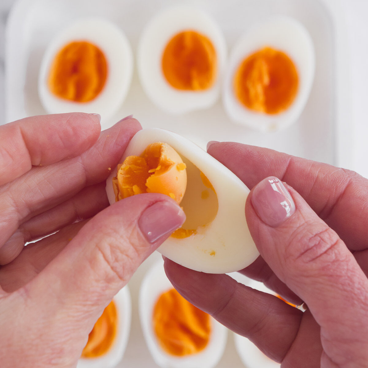 Removing the yolks to make perfect devilled eggs.