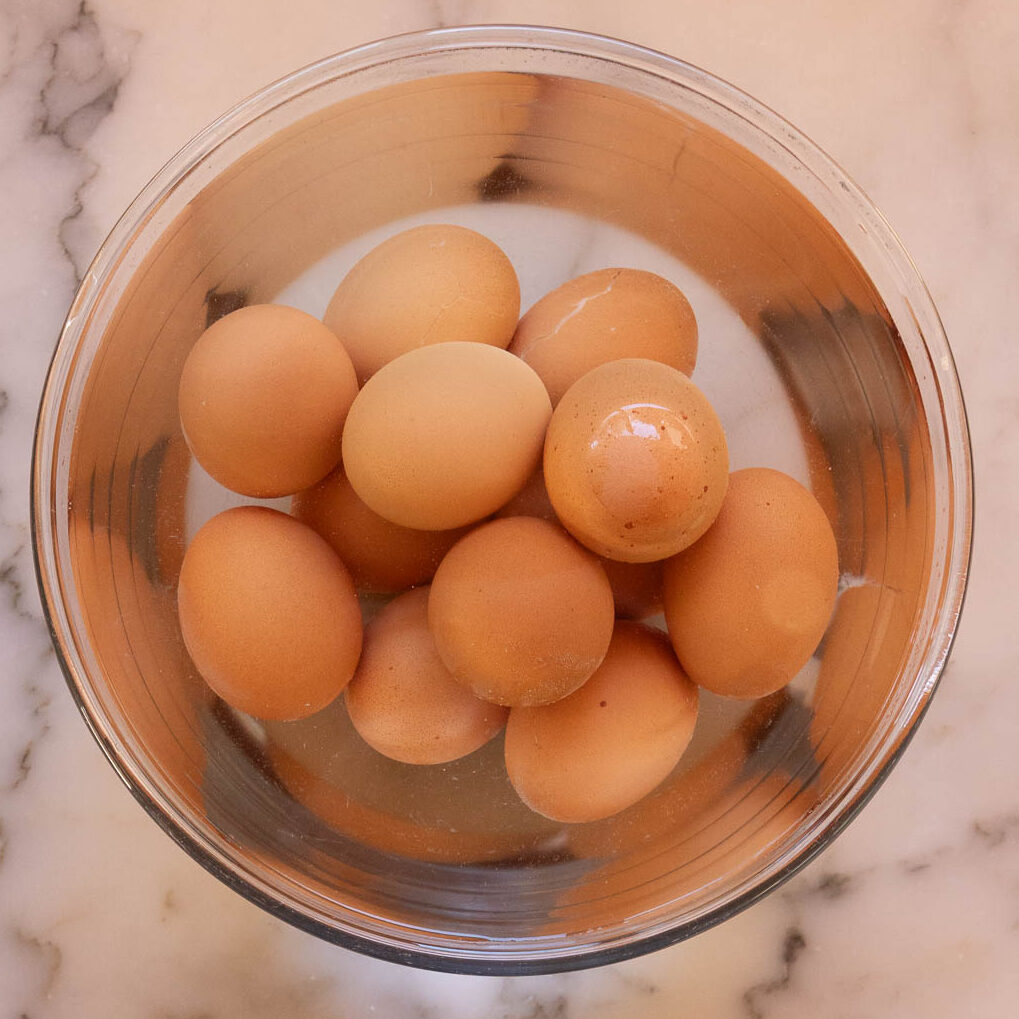 Once cooked, move eggs to a bowl of cold water, to stop the cooking.