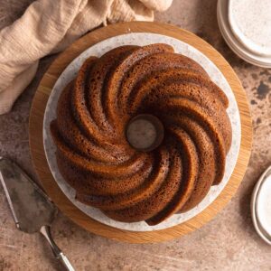 Gingerbread bundt cake served on a white plate.