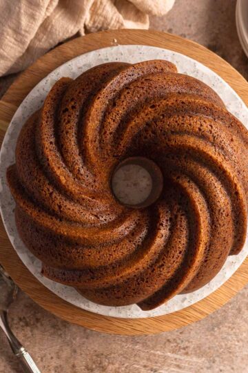 Gingerbread bundt cake served on a white plate.