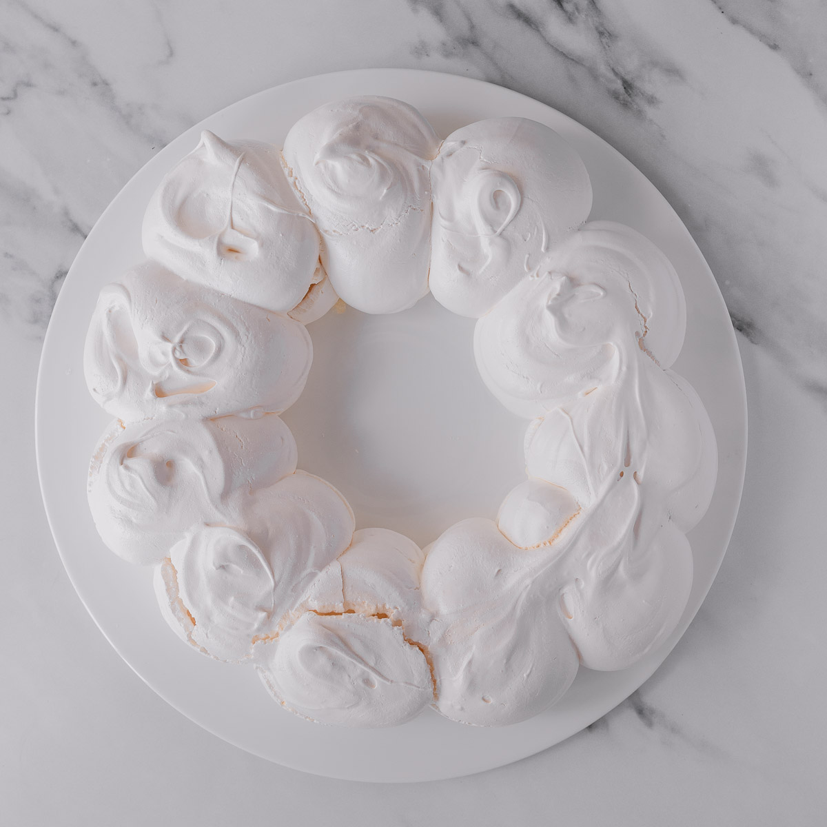 A cooked pavlova wreath, before being decorated.