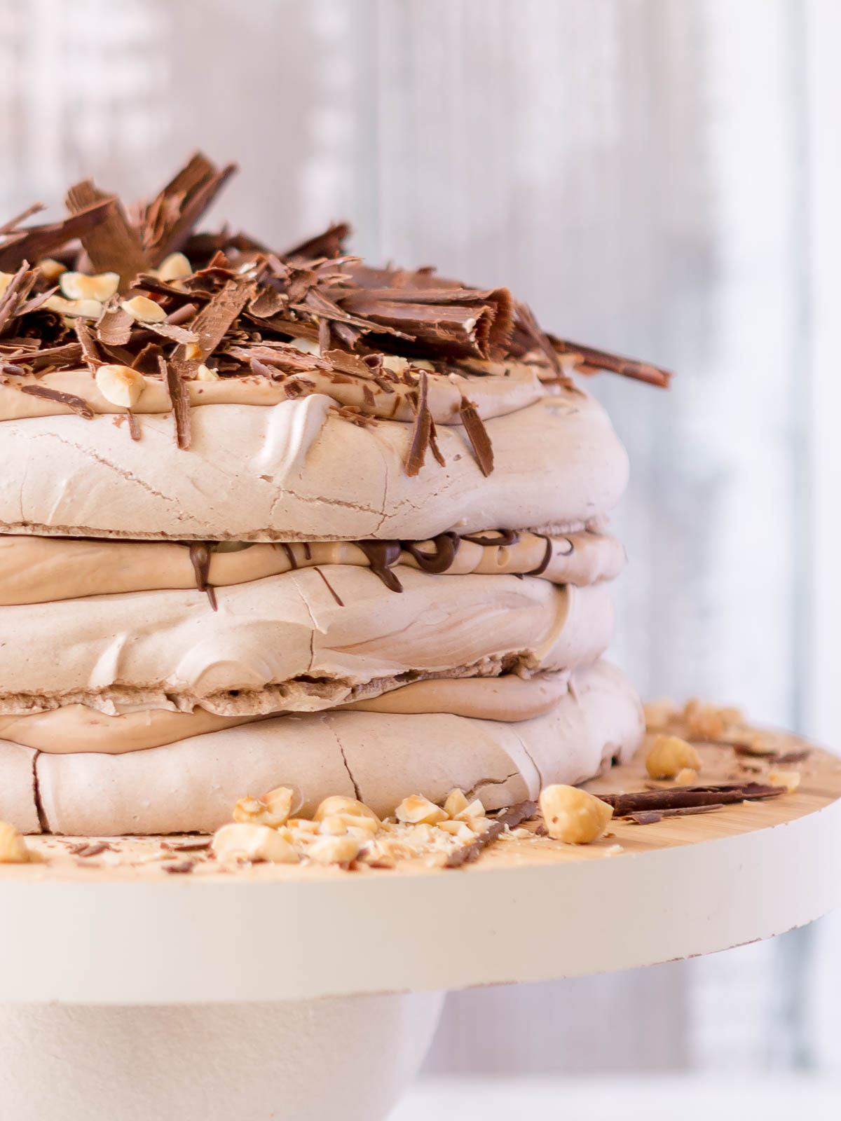 3 layers of chocolate pavlova, layered with nutella cream, dark chocolate and toasted hazelnuts.
