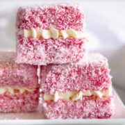 Pink lamingtons filled with chantilly cream.