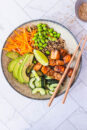 Salmon buddha bowl recipe, using sticky honey soy salmon and fresh colourful vegetables.
